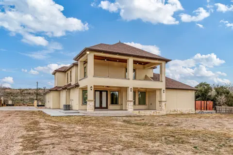 Two-story rear elevation with a covered back porch and a covered balcony above it
