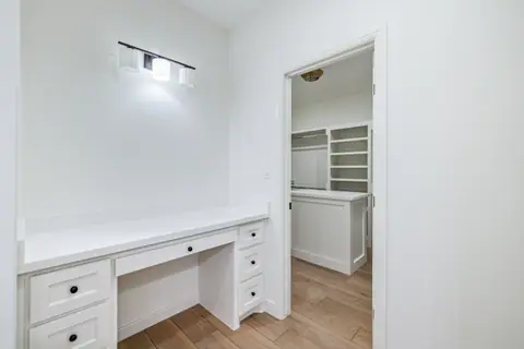 Built-in makeup vanity next to the walk-in closet